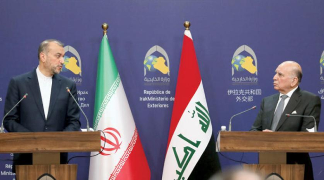 Hüseyin ve Abdullahiyan, birkaç gün önce Bağdat’ta düzenledikleri ortak basın toplantısında. (EPA) 
